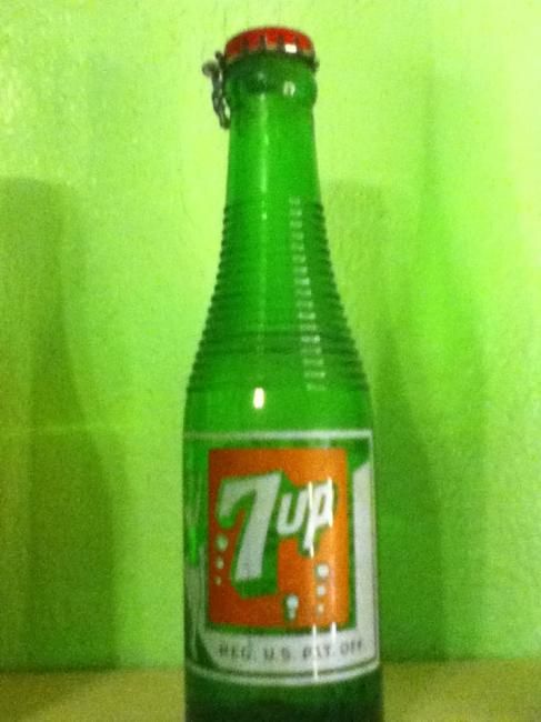 I acquired a ribbed 7up bottle still full of 7up. 